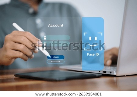 Man logging into account using face ID and stylus on digital screen with secure interface, modern biometric technology.