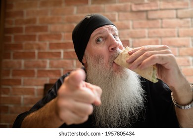 Man With Long Gray Beard Eating Taco