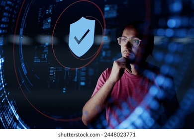 Man look at the shield with checkmark icon. Concept of data protection, cyber security, privacy, network security system, personal data, verification, secure access and security transaction.