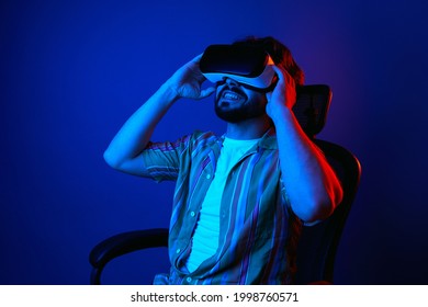 Man looking up with amazed expression while watching movies on VR headset