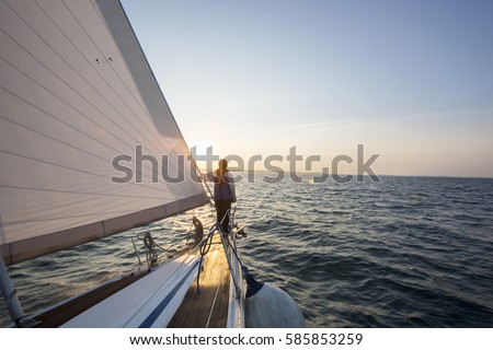 Man Looking At Beautiful Sea From Bow Of Sail Boat