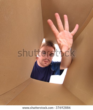 man is looking in the box
