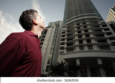 Man looking up at a building