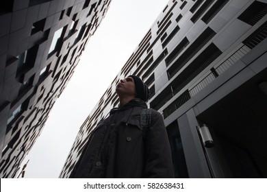 Man Looking Up To The Building