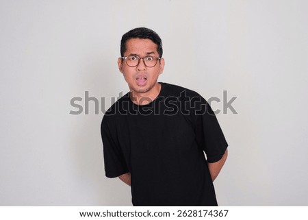 A man looking at the camera with confiused expression