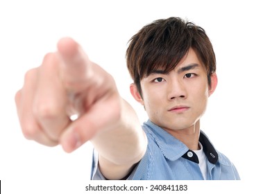 man looking at the camera and pointing her finger