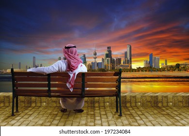 A Man Looking At The Cityscape Of Kuwait 