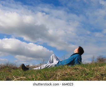 man looking at clouds