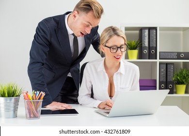 Man Looking At Colleagues Cleavage