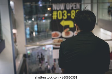 A man is looking down.