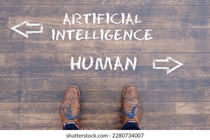 Man looking down at the words Artificial Intelligence - AI - and Human chalked onto the floor