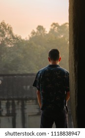 Man looking at the edge of the temple