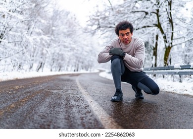 Man looking at he's watch and checking his pace, he's tired and out of his breath after a run - Shutterstock ID 2254862063