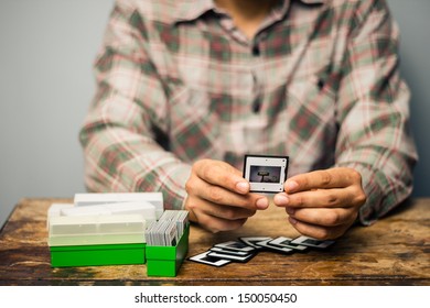 Man Looking At His Old Slides