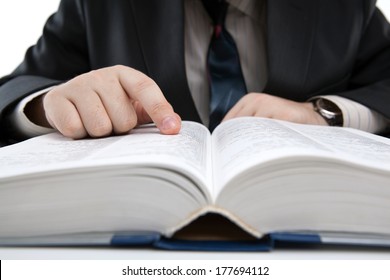 man is looking for information in the dictionary close-up - Shutterstock ID 177694112