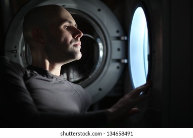 Man Looking Inside The Washing Machine