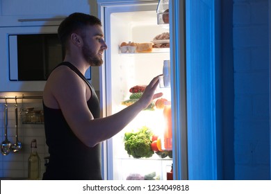 Man Looking Into Refrigerator Choosing Products Stock Photo 1234049818 ...