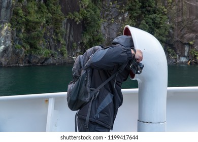 Man Looking Into A Smoke Stack On Cruise Ship