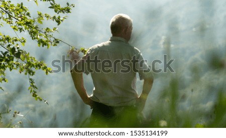 A Man Looking at the Mountain View