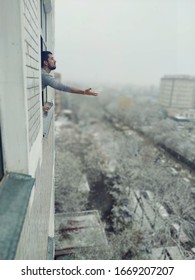 A man looking out the window. 