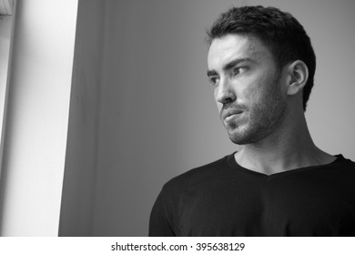 Man looking out of window