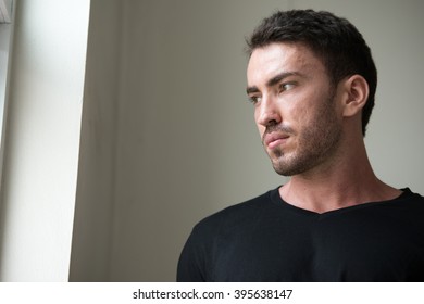 Man looking out of window