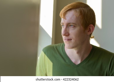 Man looking out of window