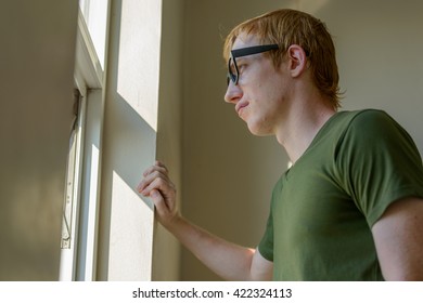 Man looking out of window