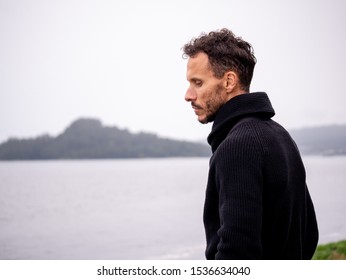 Man Looking Sad By The Sea, Isolated, Loneliness And Depression Concept