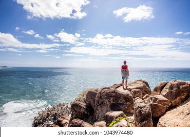 man looking at the sea - Powered by Shutterstock