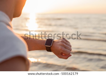 Man looking at smartwatch