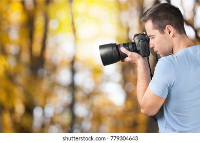 A Man looking in thre camera