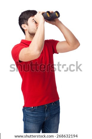 man looking through binoculars