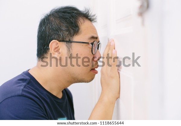Man Looking Through Door Hole Surprising Stock Photo Edit Now