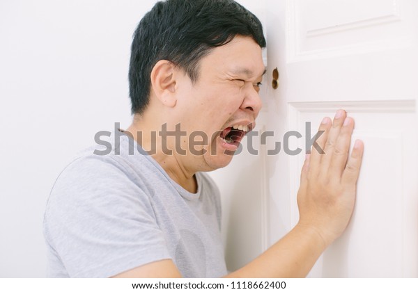 Man Looking Through Door Hole Surprising Stock Photo Edit Now