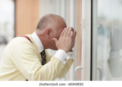 Man Looking Through The Glass And Window Shopping