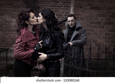 The Man Looks Like Two Women Kissing Vampires