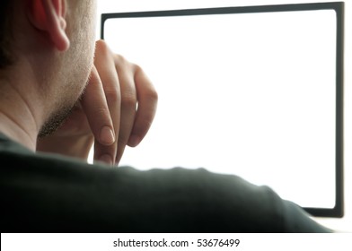Man looks at the screen.