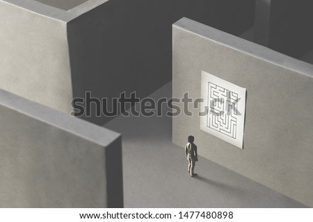 man lost in a complex maze, observing the map to find the way out;  surreal concept