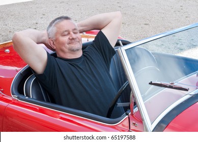 Man Loving His Red Sports Car