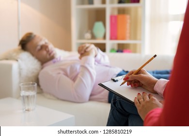 Man Lying In Couch During Hypnotherapy