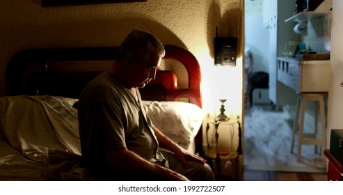 Man Lying Down In Bed And Turning Night Lamp Off, Old Man Going To Sleep