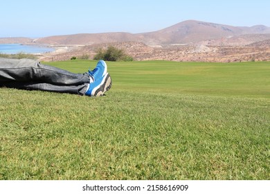 A man lying in the grass