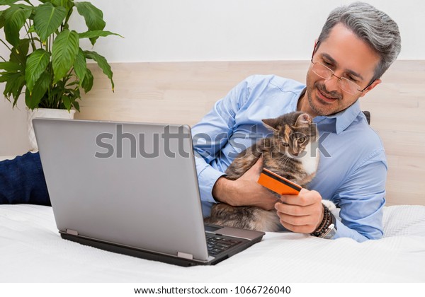 Man Lying On Bed Cat Laptop Stock Photo Edit Now 1066726040