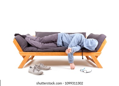 Man Lying On Couch With Hangover Isolated On White Background. 