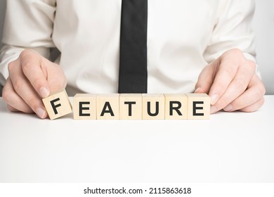 Man made word FEATURE with wood blocks - Shutterstock ID 2115863618