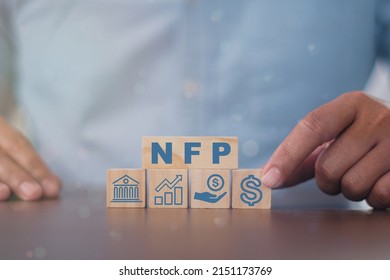 Man Made Word NFP With Wood Blocks. Nonfarm Payrolls - Key Economic Indicator. Natural Family Planning Concept
