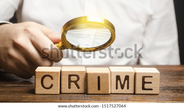 Man with a magnifying glass examines\
the word Crime. Investigation. Collection evidence, identification\
of perpetrators, familiarization with court case. Detective,\
criminal forensic expert.\
Expertise