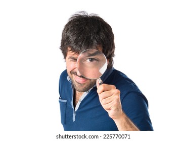 Man With Magnifying Glass Over White Background