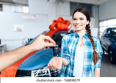 A Man Makes A Gift - A Car To His Wife. She Is Surprised At This. They Are Very Happy About This, They Are In A Good Mood.